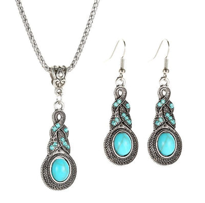 Vintage-style silver-tone necklace and dangle earrings set with oval frames and marbled blue and yellow stones. - Image 6