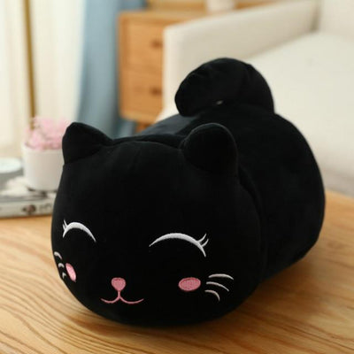 Cute orange cat plush doll with pink ears, black eyes, and embroidered whiskers, resting on a white book. - Image 10