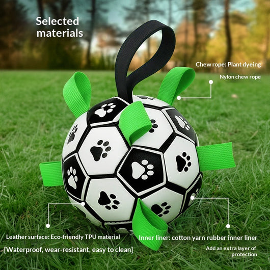 Black and white soccer ball dog toy with green fabric tabs and paw prints, 19cm, includes pump. - Image 3