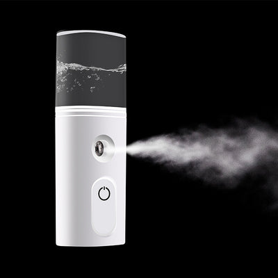 White portable facial humidifier with a clear water tank and a power button, for on-the-go moisturizing. - Image 6