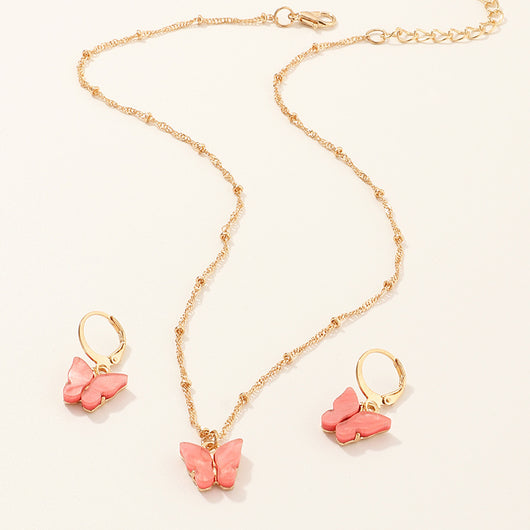 Blue resin butterfly necklace and earring set with gold-tone chains and findings, displayed on a light background. - Image 16