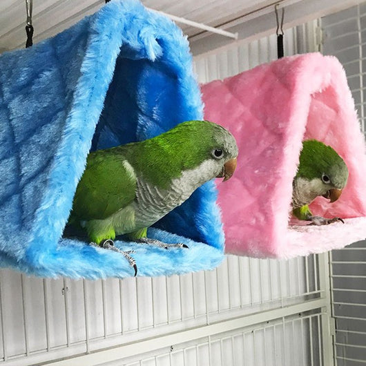 Small pink quilted plush bird's nest hammock with two metal hooks, ideal for parrots and small birds.