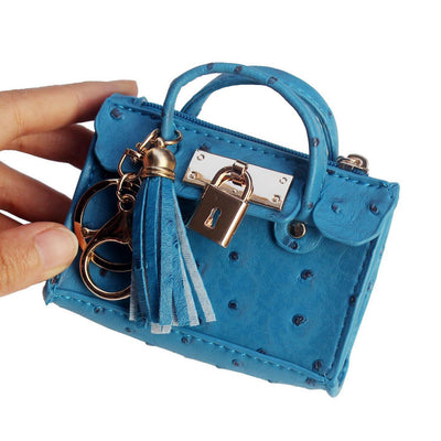 Bolso de Mano Minimalista en Cuero con Borlas - Image 3