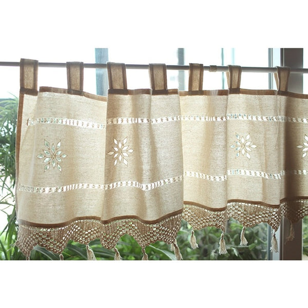 Beige cotton linen cafe curtain with tab tops, snowflake embroidery, and brown crochet trim with tassels. - Image 2