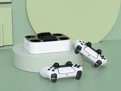 White and black dual charging dock for PS5 gamepads, featuring two charging ports and two storage slots.