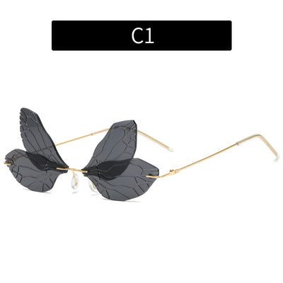 Light green rimless butterfly sunglasses with gold metal frames, featuring a unique veined lens design. - Image 5