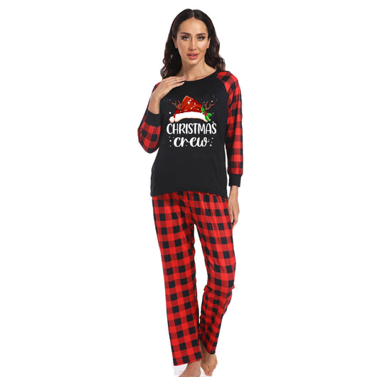 Kids' Christmas pajama set with a black "Christmas Crew" top and red and black buffalo plaid pants. - Image 4