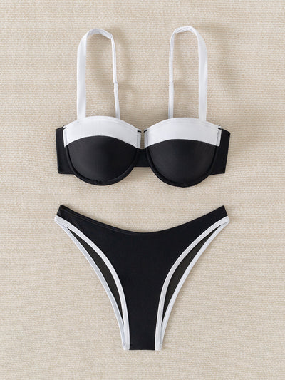 Black and white color block bikini with underwire top and high-cut bottoms, modeled by a woman by a pool. - Image 10