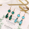 Aretes de Cristal K9 Multicolor con Borde de Cobre Geométrico