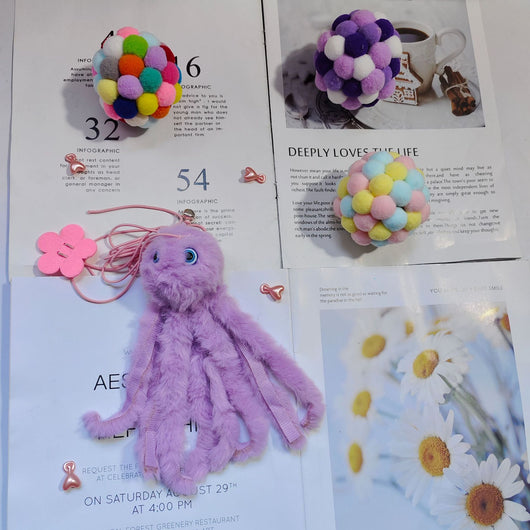 Purple plush cat teaser toy with googly eyes, elastic strings, and a pink flower attachment, resembling an octopus. - Image 5