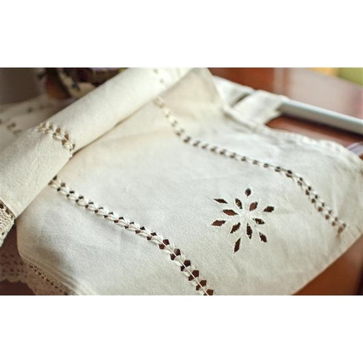 Beige cotton linen cafe curtain with tab tops, snowflake embroidery, and brown crochet trim with tassels. - Image 4