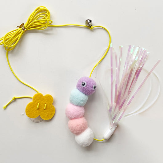 Colorful cat toy with pom-poms, googly eyes, white feathers, and a yellow elastic rope with a suction cup. - Image 17