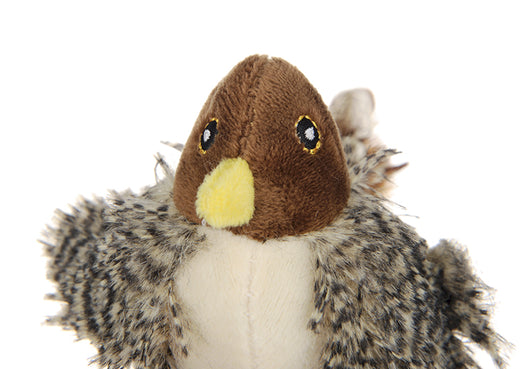 Silver tabby cat playing with a plush bird toy featuring brown and patterned feathers, a brown head, and a yellow beak. - Image 8