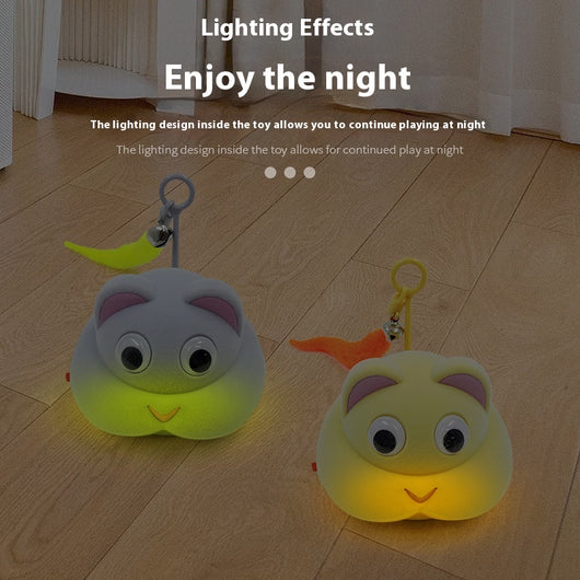 Gray pet toy shaped like a mouse or cat head with googly eyes, pink ears, and a yellow feather with a bell. - Image 3