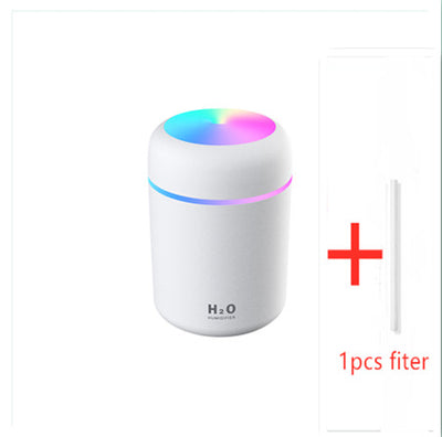 Dark gray cylindrical humidifier with colorful LED top light and thin light band, shown with five white filter sticks. - Image 3