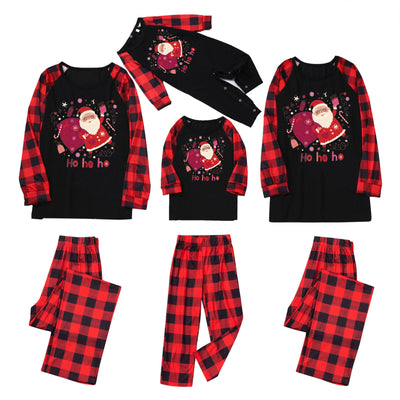 Family matching Christmas pajamas with black tops featuring a Santa graphic and red buffalo plaid sleeves and pants. - Image 5