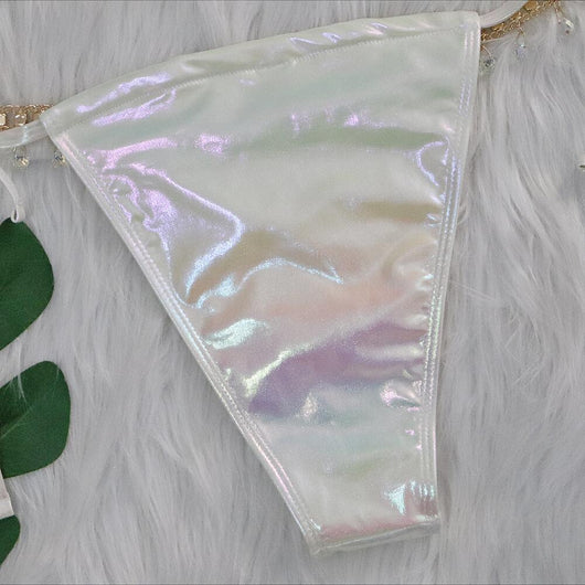 Iridescent purple and pink two-piece bikini with gold-toned crystal embellishments on a white faux fur background. - Image 32