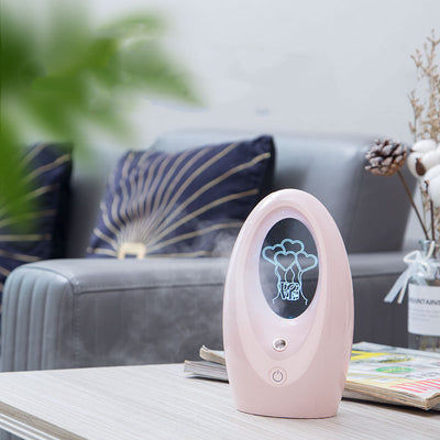Navy blue USB humidifier with an oval shape and an illuminated castle design in the center. - Image 4