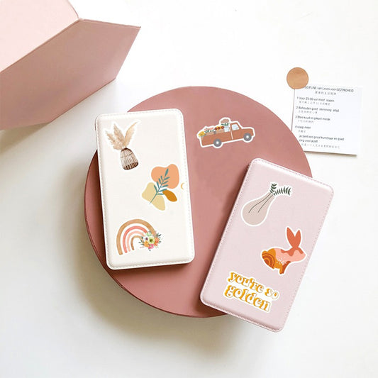 A large collection of bohemian-style stickers featuring rainbows, flowers, animals, and inspirational quotes like "be a kind human" and "choose happy."
