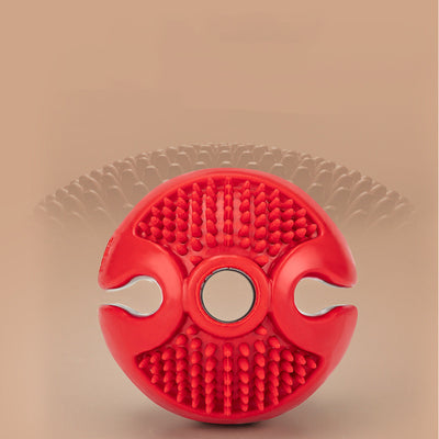 Red rubber pet chew toy ball with textured nubs and four openings for dispensing treats. - Image 4