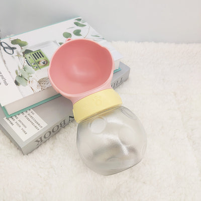 Portable pet water bottle with white drinking bowl, translucent grey reservoir, and yellow paw print band. - Image 5