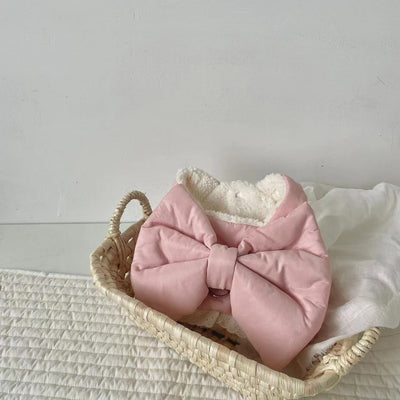 Creamy-white plush dog harness with a large decorative bow on the back, worn by a small poodle-like dog. - Image 15