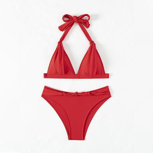 Red lace-up halterneck bikini modeled by a woman against a blue ocean and distant coastline. - Image 4