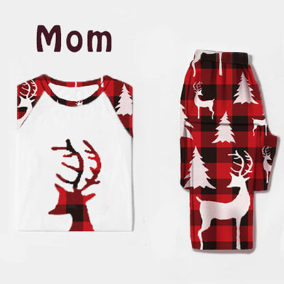 Women's Christmas pajama set with white raglan top featuring a red plaid deer head and matching red plaid pants with deer and trees. - Image 4