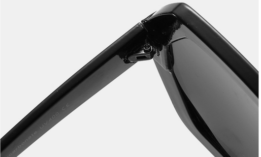 Octagonal sunglasses with brown gradient lenses and a tortoiseshell chain strap on a white background. - Image 9