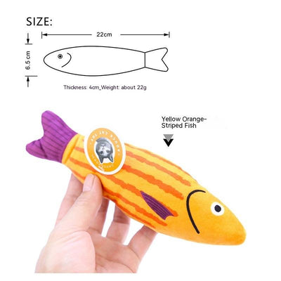 Orange fish-shaped plush catnip toy with blue fins and tail, held in a hand, with a small round tag. - Image 14