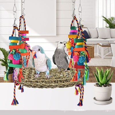 Colorful parrot toy with a woven grass hammock, hanging ropes, wooden blocks, and woven balls, with two parrots. - Image 6