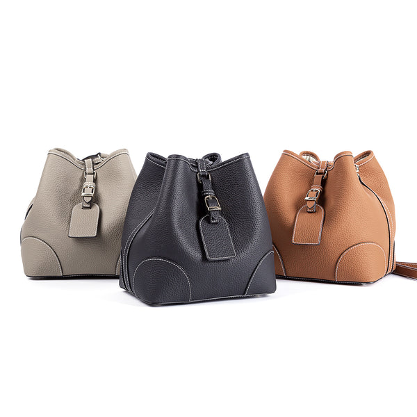 Bolso Cubo Retro de Cuero Genuino con Patrón Grabado y Cordón Ajustable