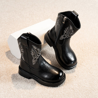 Girls' brown Martin boots with white ethnic embroidery, side zippers, and black soles, displayed on a light carpet. - Image 2