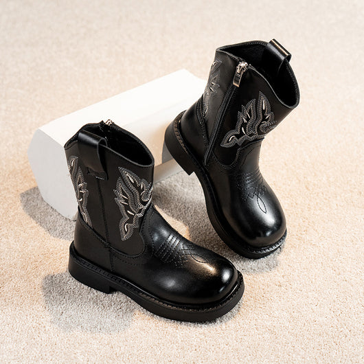 Girls' brown Martin boots with white ethnic embroidery, side zippers, and black soles, displayed on a light carpet. - Image 2
