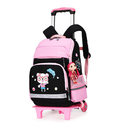 Pink and black detachable trolley backpack for elementary school students with a cartoon bear graphic and doll charm. - Image 5