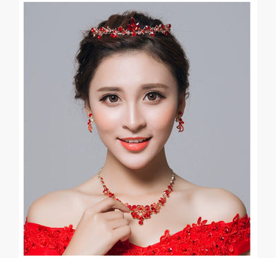 Red rhinestone bridal jewelry set featuring a floral necklace and matching dangle earrings on a model. - Image 10