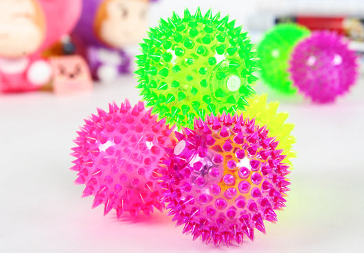 Four glowing sea urchin balls in neon pink, green, and yellow, with soft rubber spikes, for pets. - Image 6