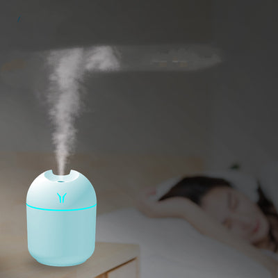 Light blue mini desktop humidifier with an orange accent line and a small orange logo, featuring a single mist outlet. - Image 7