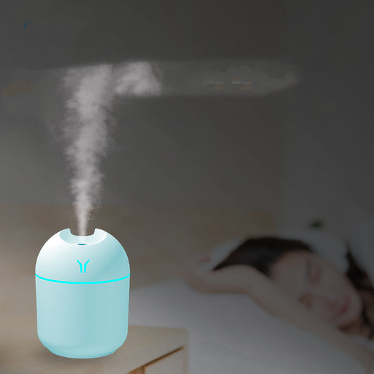 Light blue mini desktop humidifier with an orange accent line and a small orange logo, featuring a single mist outlet. - Image 7