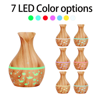 Dark wood grain humidifier shaped like a vase, with glowing green animal cutouts and mist emitting from the top. - Image 11