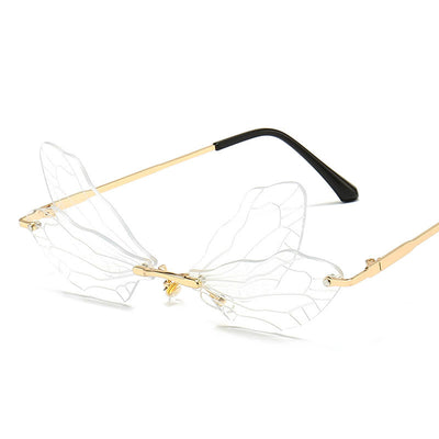 Frameless sunglasses with pink and orange-yellow dragonfly wing-shaped lenses and gold-colored metal temples. - Image 16