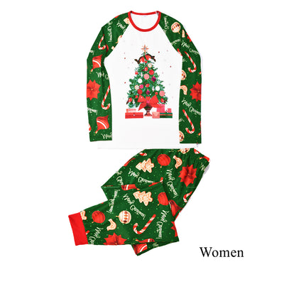 Green baby Christmas pajama romper with red trim, featuring candy canes, ornaments, gingerbread men, and poinsettias. - Image 3