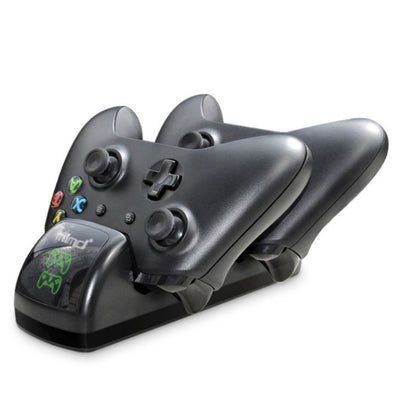 Black dual charging dock for Xbox One wireless controllers with an LED display, shown with two black controllers. - Image 15