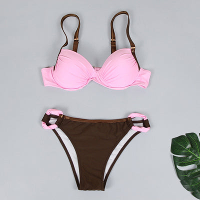 Women's two-piece swimsuit with a pink pleated bandeau top and brown bikini bottoms with pink accents, by the ocean. - Image 18