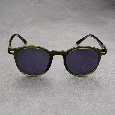 Fashionable round-frame sunglasses with transparent gray frames and dark gray lenses on a gray surface. - Image 16