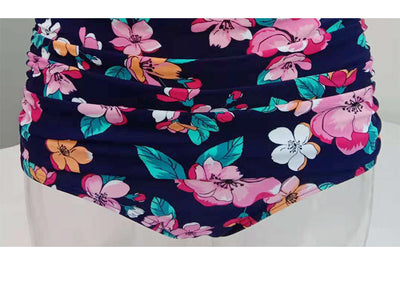 Navy blue floral high-waisted bikini with a halter top and front tie knot, featuring pink, orange, and white flowers. - Image 11