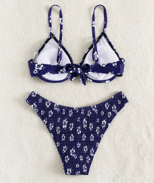 Periwinkle blue two-piece swimsuit with white floral pattern and ruched texture, featuring an underwire bikini top and high-cut bottoms. - Image 24
