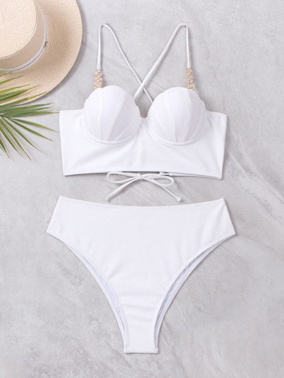 White textured two-piece bikini with a scalloped top and high-waisted bottom, worn by a woman on a sandy beach. - Image 12