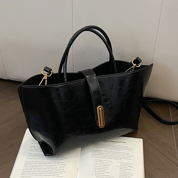 Bolso Bucket de Cuero Encerado Elegante y Portátil