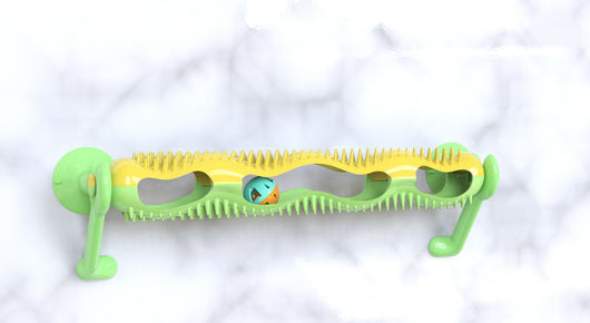 Grey tabby kitten playing with a yellow and teal wall-mounted cat toy featuring a track with rolling balls. - Image 11